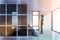 African woman in white and glass bedroom