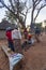 African women cooking around fire