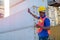 African worker man stand and lift hand and show hand symbol of stop for truck in cargo container shipping area