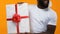 African young man white t-shirt holding big gift box, christmas sale, festivity