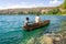 Africans in canoe on beautiful Chala lake, Kenya and Tanzania bo