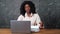 Afro-american businesswoman opens envelope and enters code