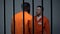 Afro-american and caucasian criminals quarreling in prison racial discrimination