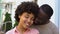 Afro-american couple enjoying date, girl feeling safe in boyfriend arms, smiling