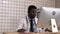 Afro american doctor with migraine overworked, overstressed. Negative human emotions