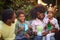 Afro american  family  playing with paper boats, celebrate birthday party and have fun  together