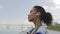 Afro-american Fitness woman warms up and stretching outdoors before run