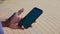 Afro-american man finger touches smartphone display with chroma key green screen
