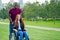 Afro american man marriage proposal giving a ring to his redhaired ginger girlfriend.she sitting on wheel chair and
