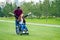 Afro american man marriage proposal giving a ring to his redhaired ginger girlfriend.she sitting on wheel chair and