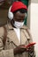 Afro-American passenger man standing in subway train, wear face medical mask to protect yourself from contact with flu virus,