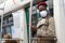 Afro-American passenger man standing in subway train, wear face medical mask to protect yourself from contact with flu virus,