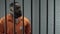 Afro-american prisoner making arrangement with prison guard, corruption in jail