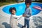 Afro-American Siblings Delight in Poolside Laughter