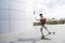 Afro-american skateboarder makes stunt in summer day