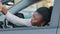 Afro american stressed woman driver african ethnic girl sitting inside luxury car screaming angry waving hands make stop