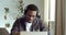 Afro american teacher programmer salesman boss consultant in headphones speaks via video communication online chat