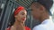 Afro-american teen boy lovingly holding pretty girlfriend face, trying to kiss