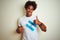 Afro american tourist man holding Argentinian Argentina flag over isolated white background happy with big smile doing ok sign,