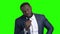 Afro-american tv presenter on green screen.