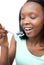 Afro-american woman eating a yogurt