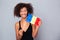 Afro american woman holding Romanian flag