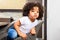 Afro child sitting at the table