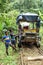 Afro-Ecuadorian boy in front of a `ghost train` in the jungle