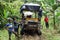 Afro-Ecuadorian boy in front of a `ghost train` in the jungle