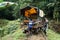 Afro-Ecuadorian men turning a `ghost train` in the jungle