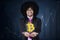 Afro entrepreneur showing bitcoin symbol