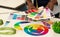 Afro Female Hands Choosing Color Samples In Design Studio, Closeup