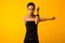 Afro Girl Doing Deltoid Arm Stretch Exercise Over Yellow Background