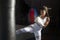 Afro girl training kickboxing inside the gym, strength, inspiration, determination