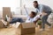 Afro Husband Riding Wife In Moving Box In New House