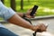 Afro man riding bike and using smartphone with black screen