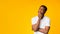 Afro Man Thinking Touching Chin Standing Over Yellow Background, Panorama
