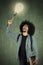 Afro student pointing at light bulb