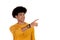 Afro teenager with yellow t-shirt pointing something with his finger