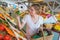 Afro woman shopping organic veggies and fruits