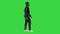 Afroamerican Jazz Musician with Trumpet Walking and Playing on a Green Screen, Chroma Key.