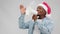 Afroamerican man in christmas hat is speaking loudspeaker on sale, black friday.