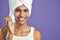 Afroamerican transgender young man looking camera and smile in towel. Trans gender male skin care