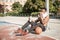 Afroamerican young man playing street basketball in the park