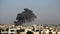 Aftermath of Israeli Air Strikes: Smoke Rises Over the City - Extra Large