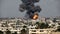 Aftermath of Israeli Air Strikes: Smoke Rises Over the City - Extra Large