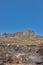 The aftermath of a natural mountain landscape destroyed by wildfire destruction on table mountain in Cape Town, South