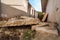 Aftermath remains of hurricane or earthquake disaster damage on ruined old house with collapsed roof and brick walls selective foc