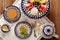 Afternoon coffee and cake with jelly and fruits on wooden background