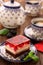 Afternoon coffee and cake with jelly and fruits on wooden background